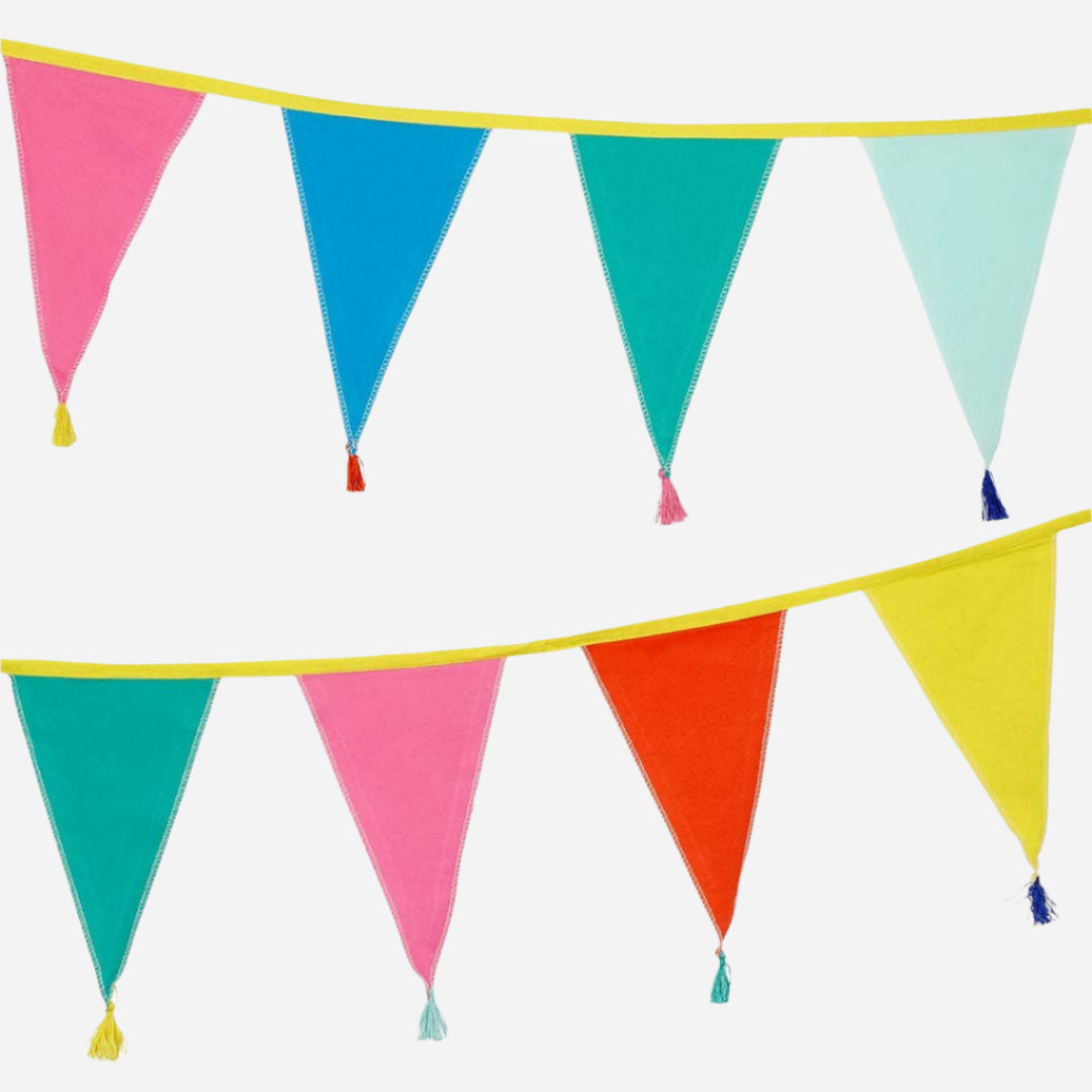 Two rows of rainbow fabric cotton bunting. Each flag is a different colour and each has a contrast colour tassle. Line fabric is yellow. Flags are pink, red, blue, turquoise, yellow, light blue.
