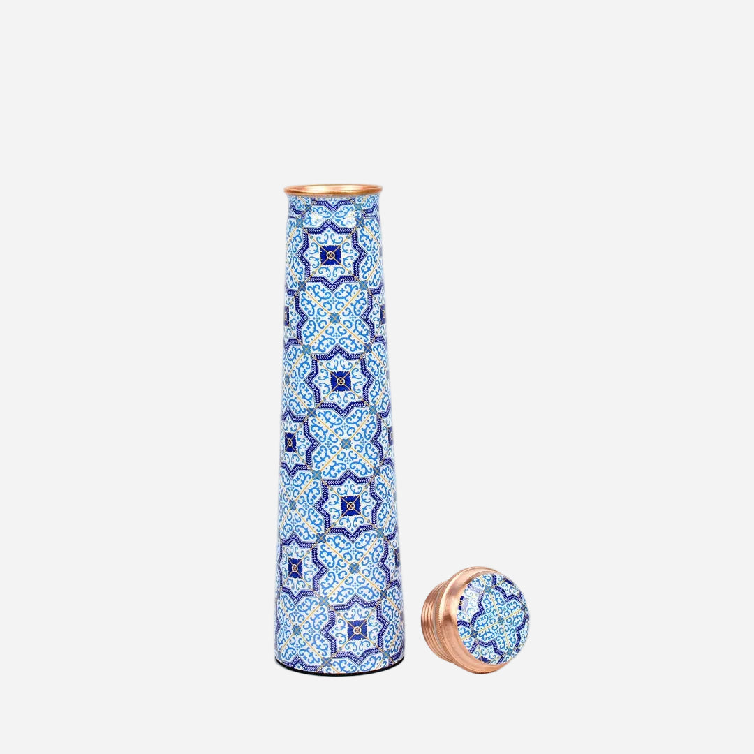 Decorative tower copper water bottle with blue and white pattern on a white background