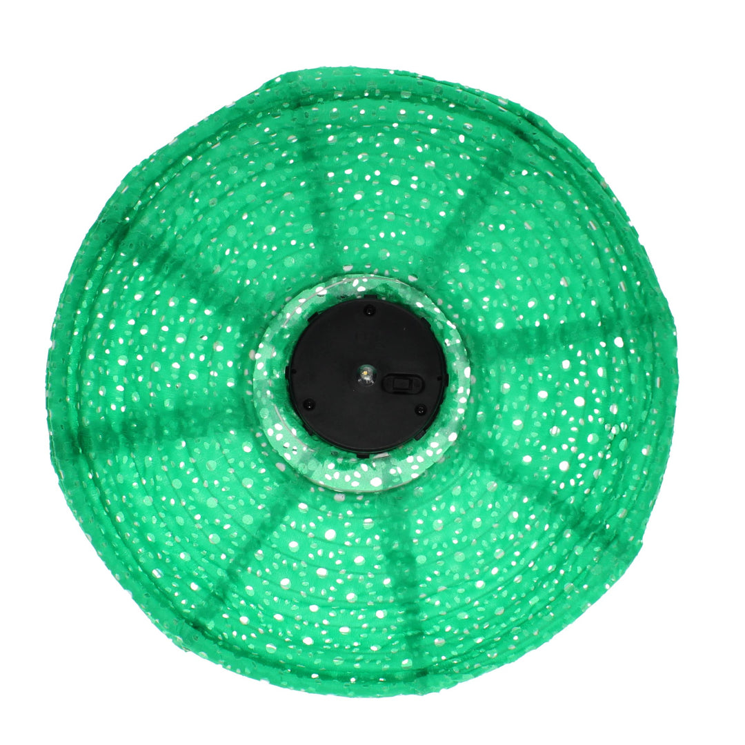 Green fabric solar lantern from below on a white background