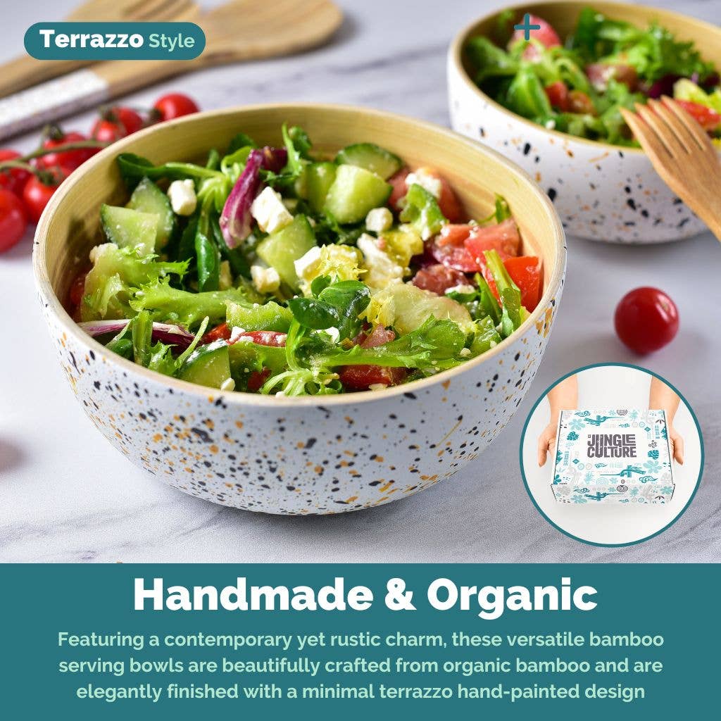 Bamboo serving bowls with terrazzo pattern filled with salad on a marble surface.