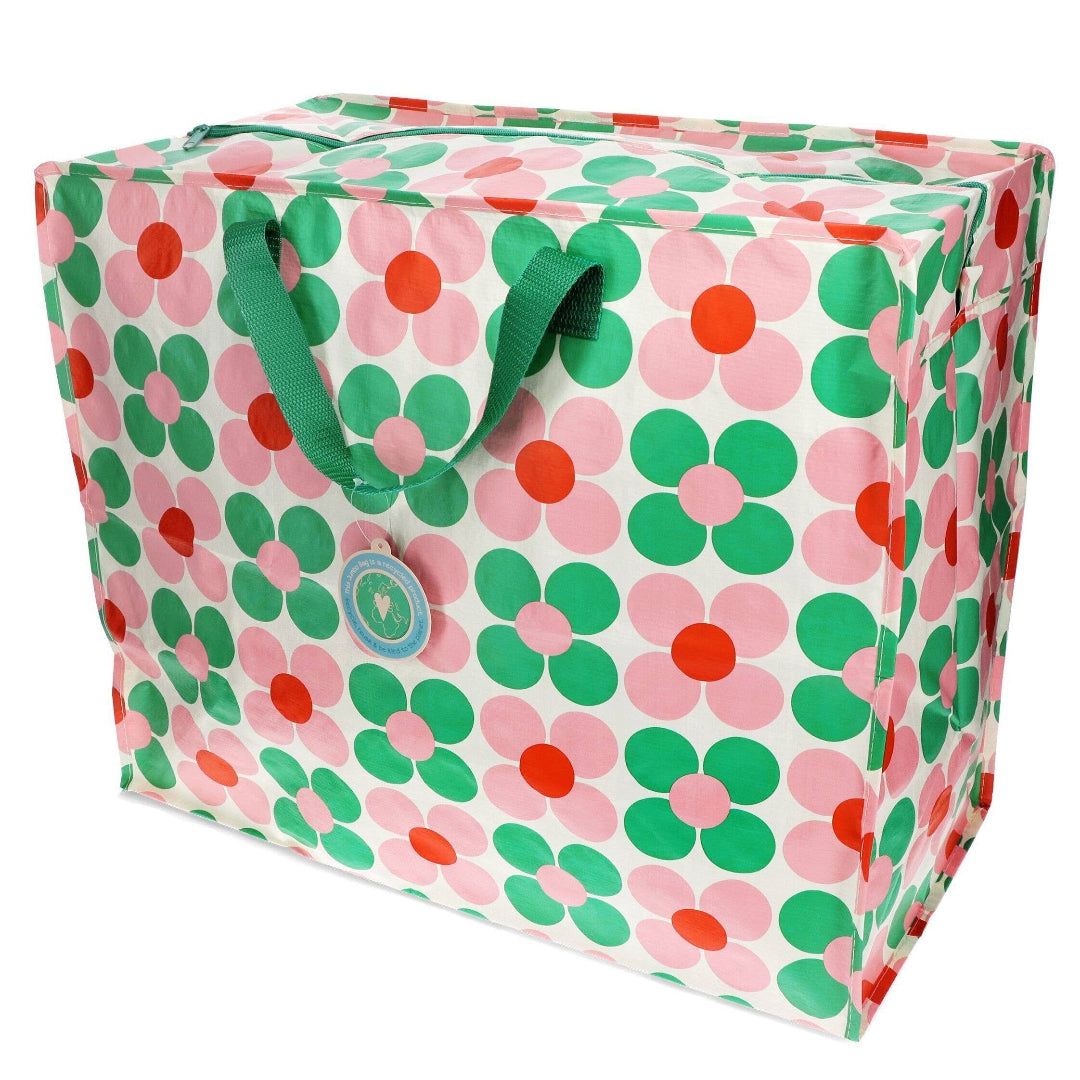 Floral-patterned box with green handles on a white background