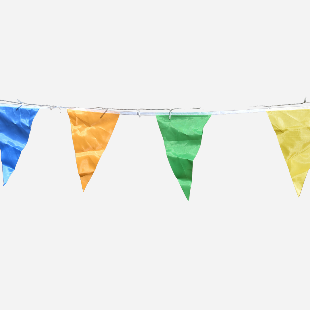 blue orange green and yellow triangular flags on a string with warm yellow string lights on a grey background