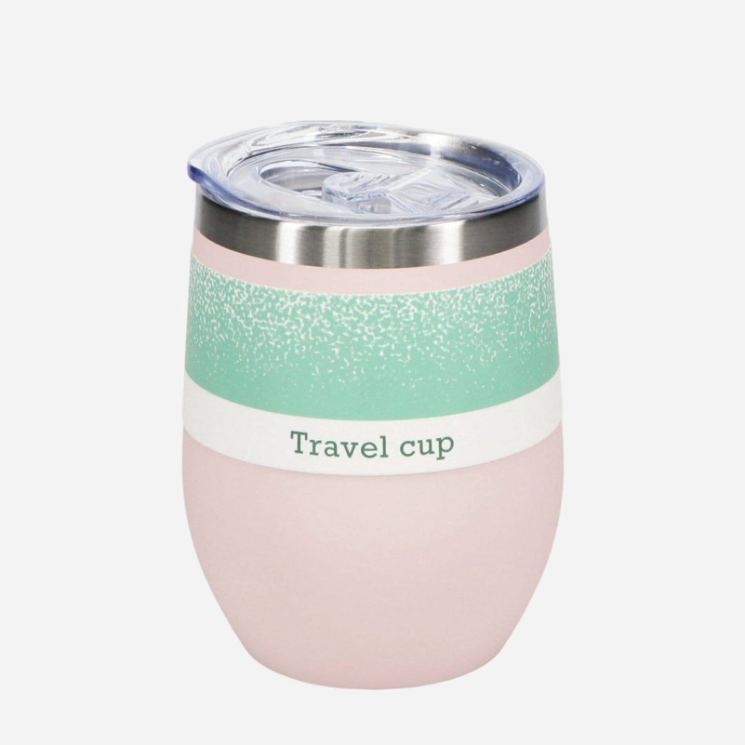 Pink travel cup with a green band label and clear lid on a white background