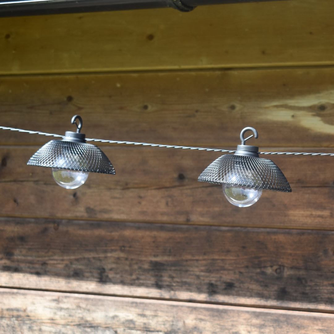 two of ten black mesh lanterns with clear round bulb (string lights)