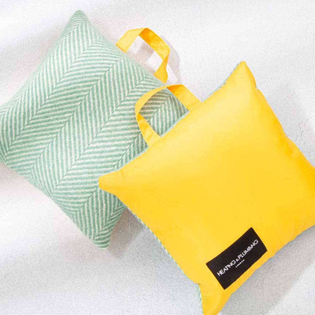 Green and yellow pillows on a white background