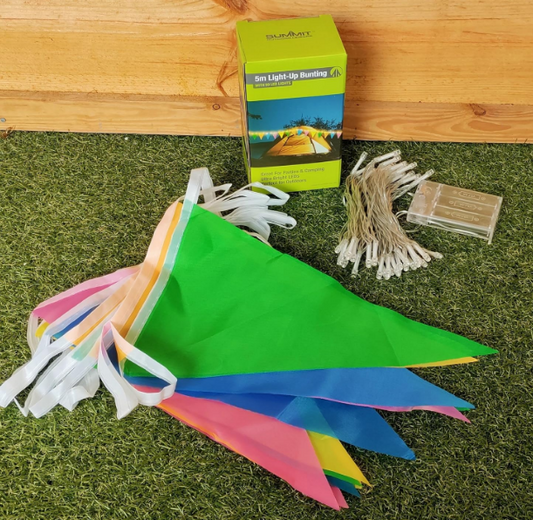 Multicoloured triangular bunting flags with white string. Separate string of white fairy lights. Displayed in front of box.