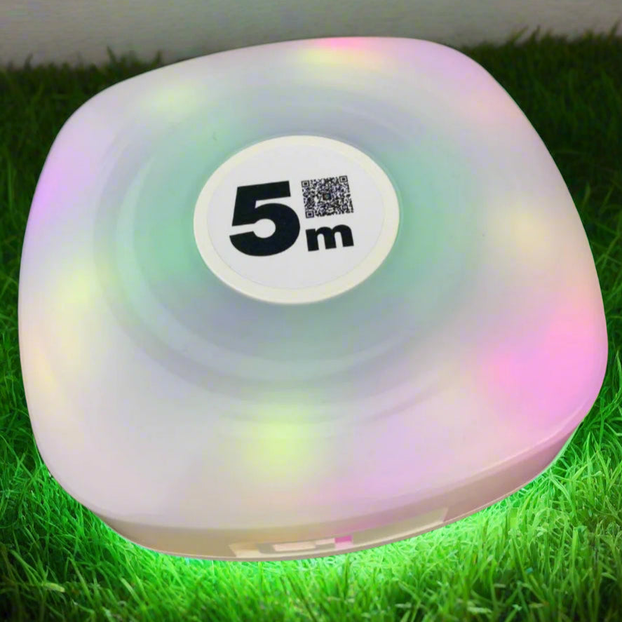 Camping string light storage, rounded square shape, switched on with multi-colour lights.