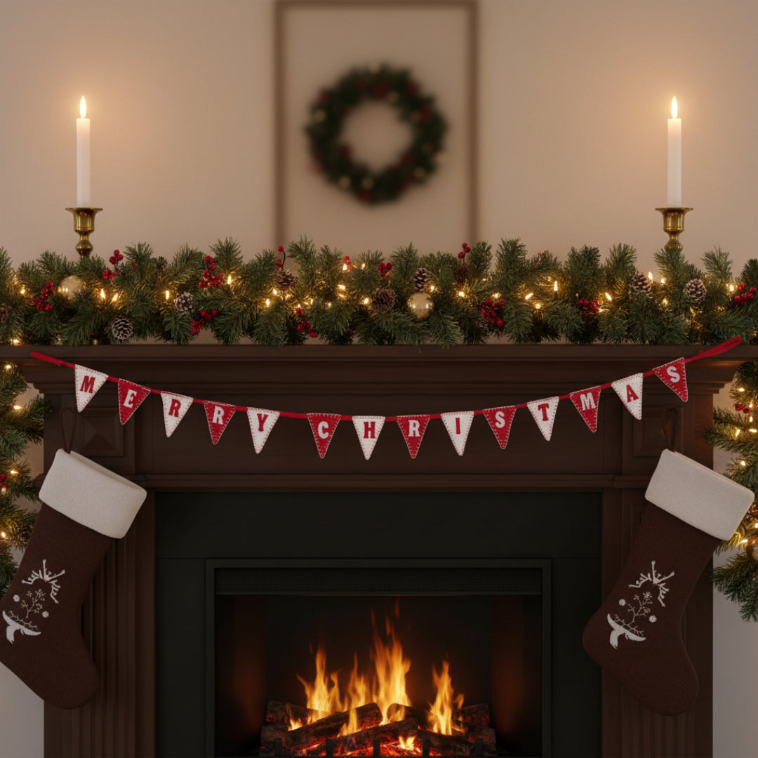 Red and white 'Merry Christmas' banner on a Christmas mantelpiece