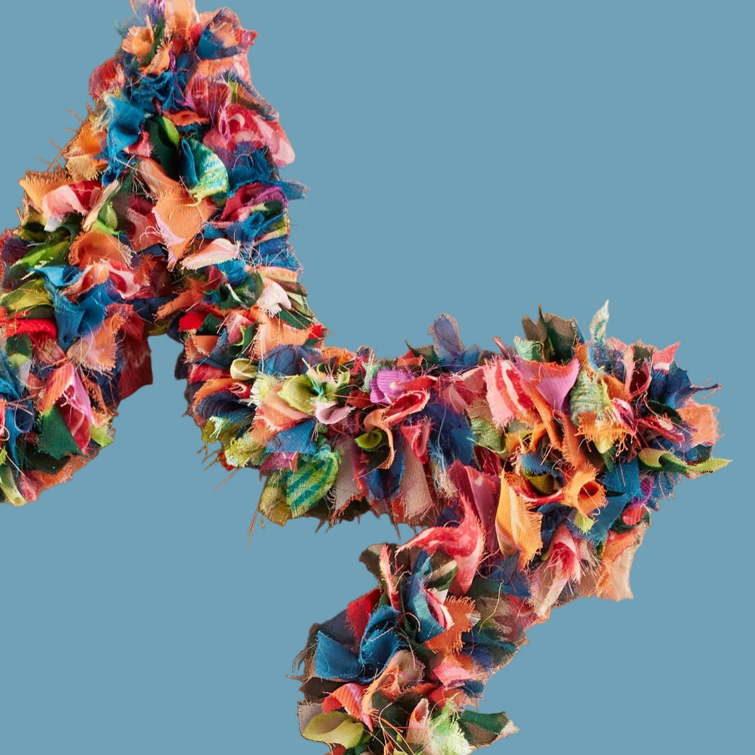 xlose up of recycled sari star wreath only half showing