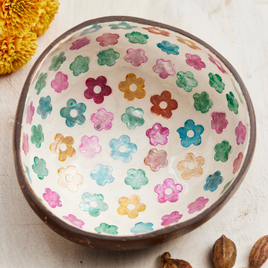 coconut bowl with floral pattern on a light background
