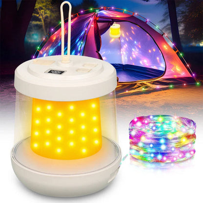 White camping lantern with yellow light and colorful LED string lights in front of a tent.