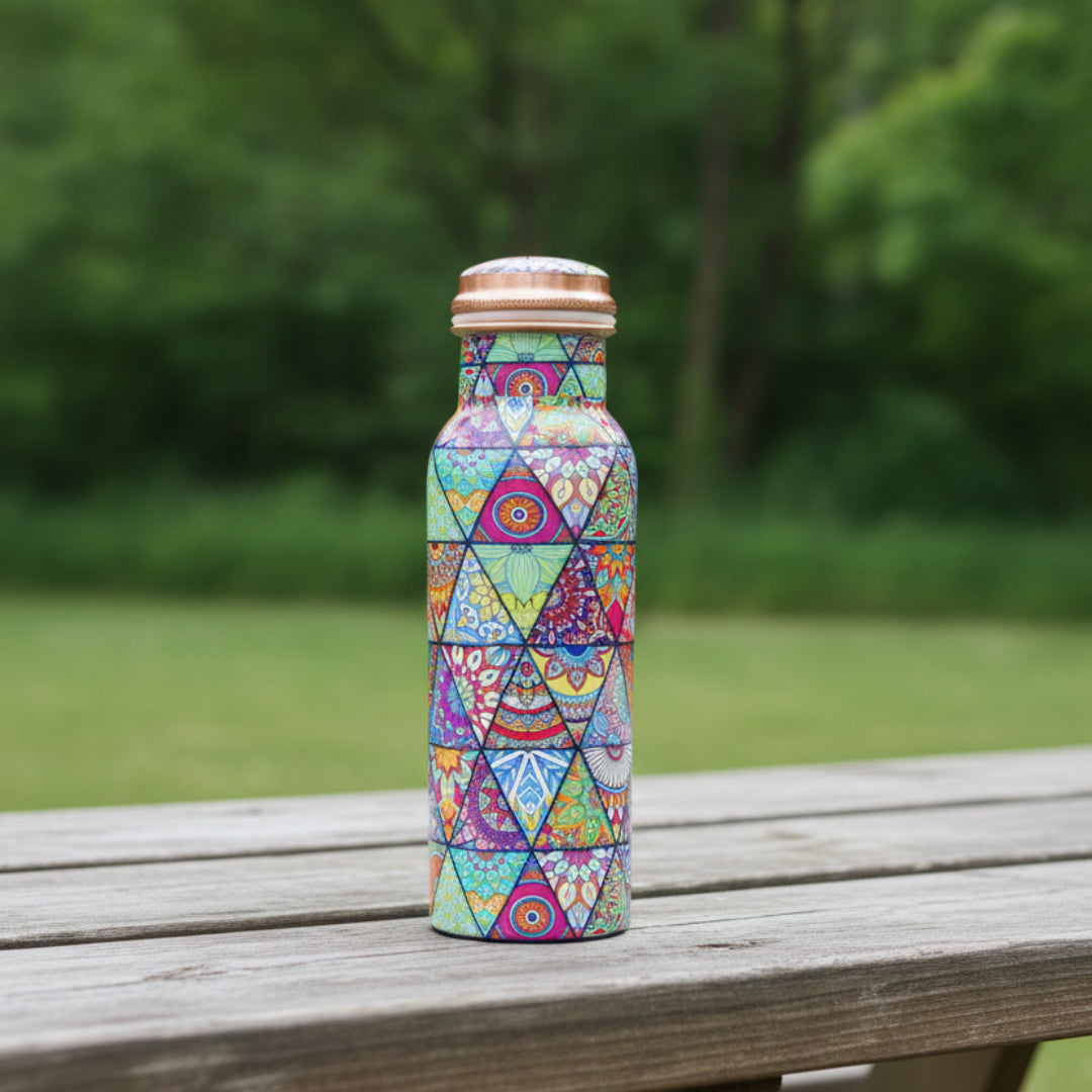 Colorful geometric patterned water bottle on a white background