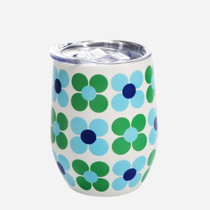 Tumbler with blue and green floral pattern on a white background