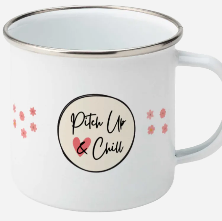 white enamel camping mug with handle to the right and Pitch Up and Chill logo in the centre and pink flower either side.