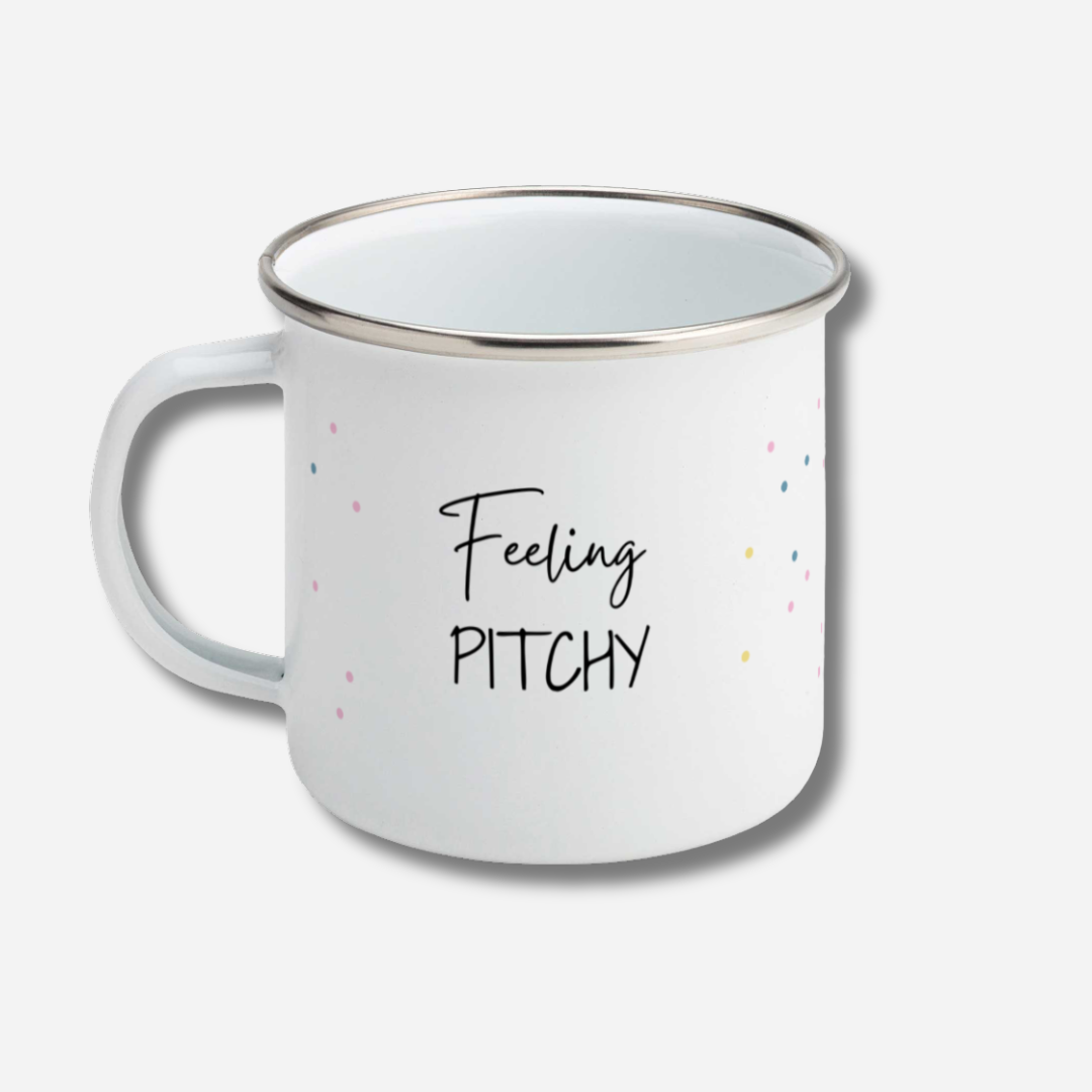 White mug with 'Feeling Pitchy' text on a light gray background