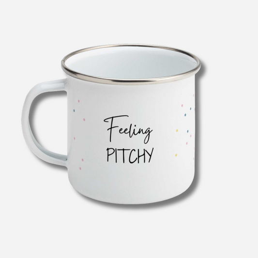 White mug with 'Feeling Pitchy' text on a light gray background