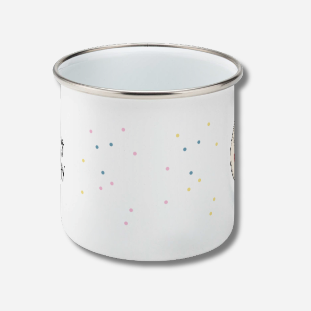 White enamel mug with colorful polka dots on a white background