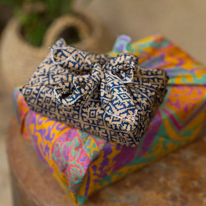 Colorful wrapped gifts on a wooden surface