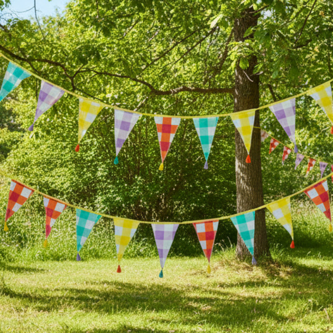 Colorful gingham bunting flags on a woodland background