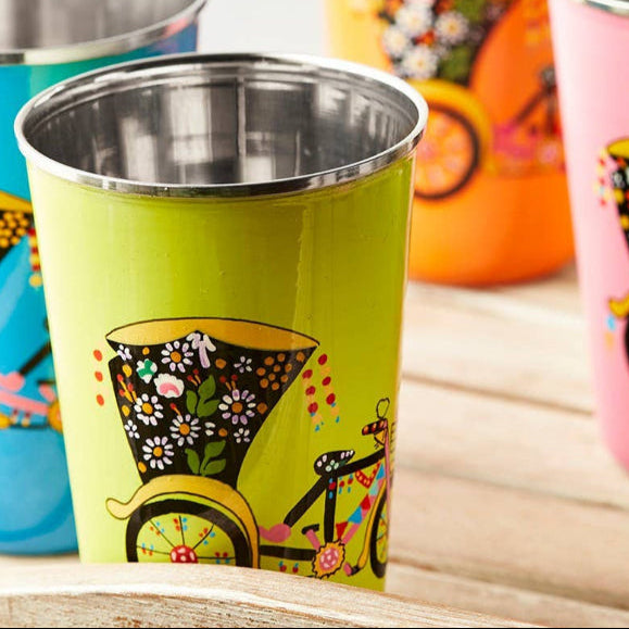 hand painted green stainless steel tumblers with rickshaw design displayed on a wooden tray.