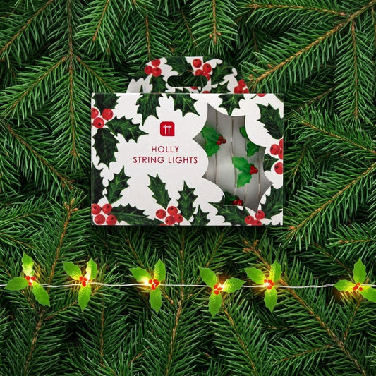Holly string lights with packaging featuring holly leaves and berries on a white background