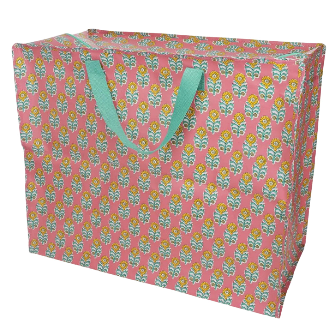 Floral-patterned storage bag with light green handles on a white background