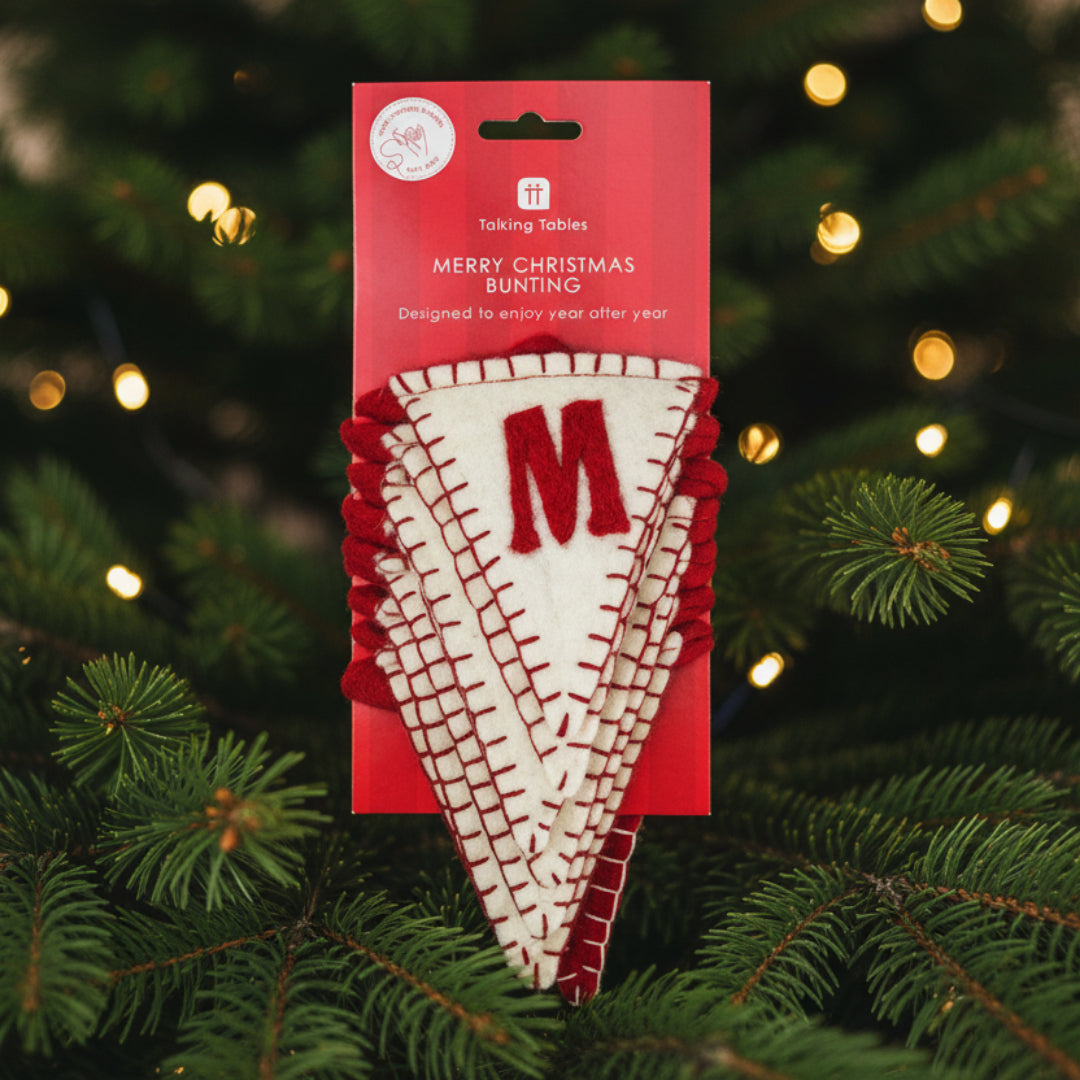 Red and white Christmas bunting with letter 'M' on a red packaging with text, "Merry Christmas Bunting"