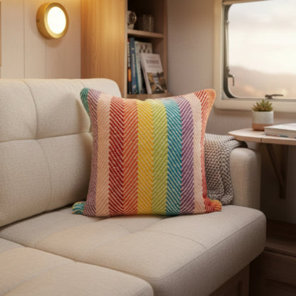 Colorful striped cushion cover with a zigzag pattern on a caravan sofa