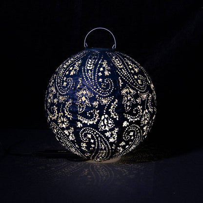 Decorative spherical navy lantern with intricate patterns on a black background