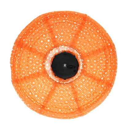 orange solar lantern picture from below showing the black underside of the solar battery in the centre