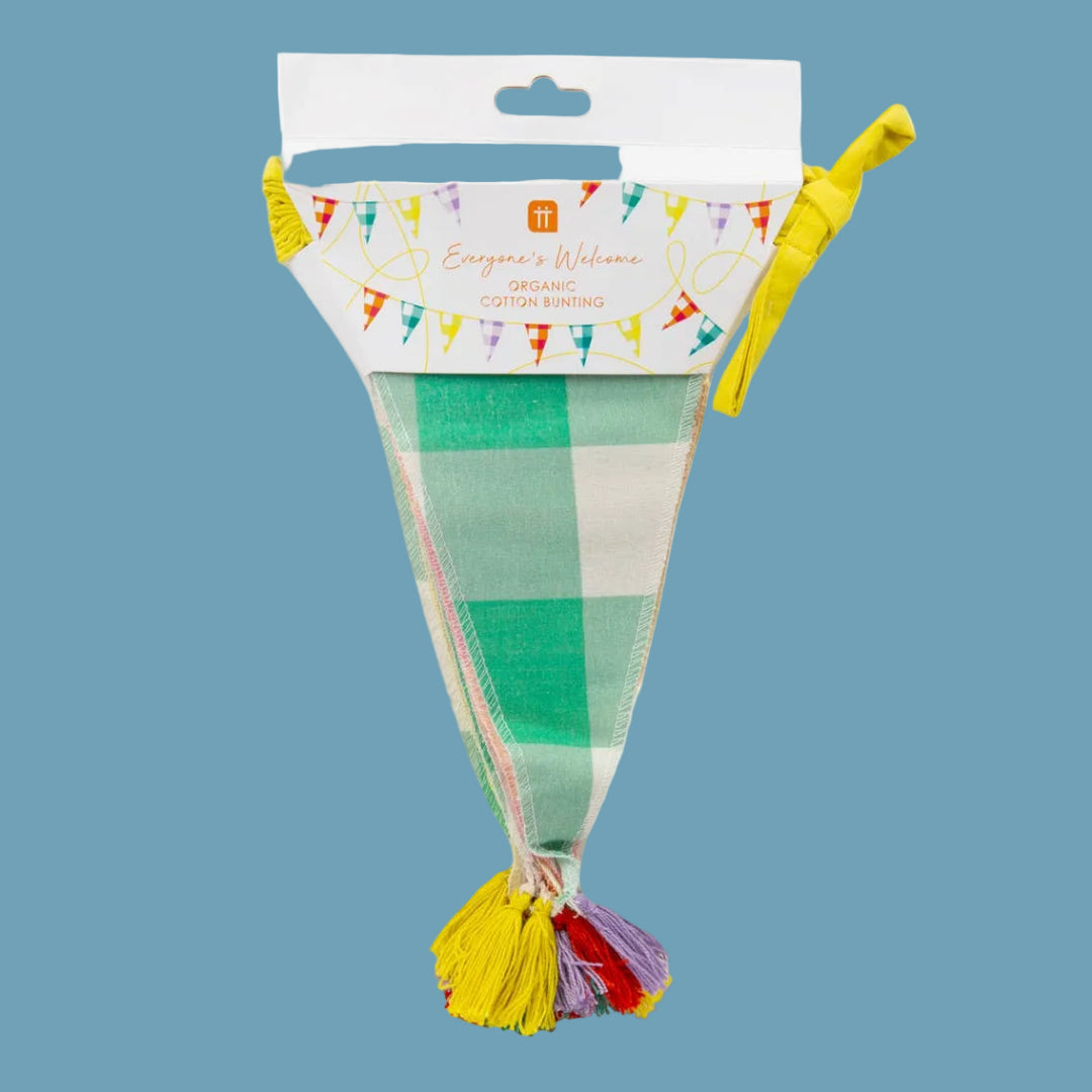 Gingham bunting with colorful tassels on a blue background