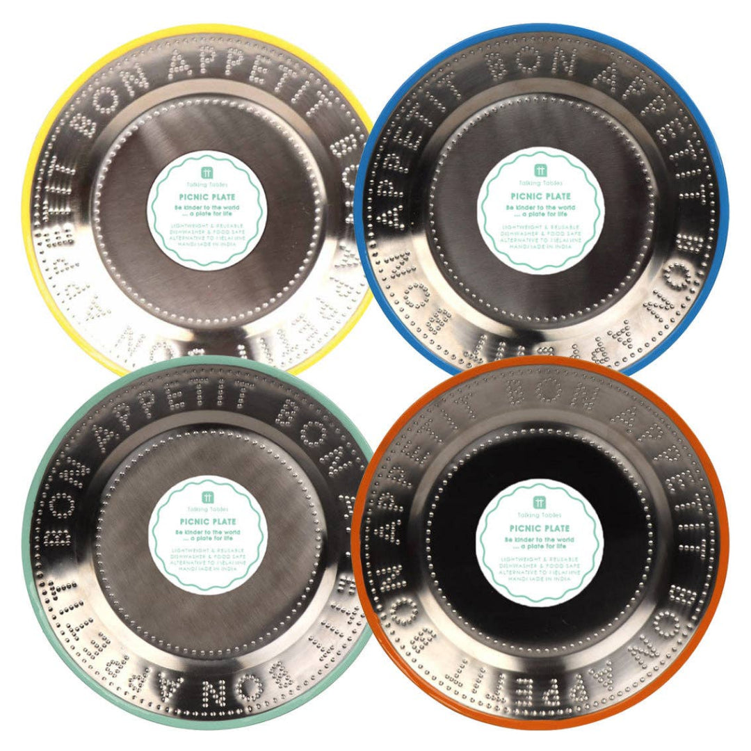 Four round metal plates with 'Bon Appetit' text on a white  background