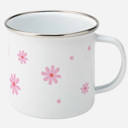 white enamel mug with pink daisy flowers of varying sizes and handle to the right.