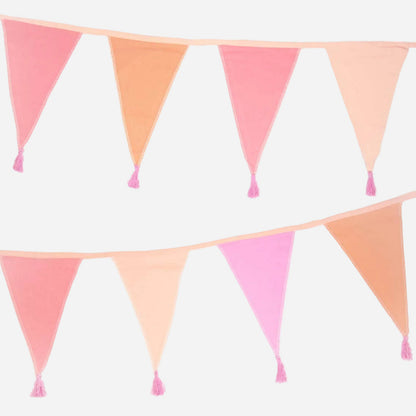 Pink and peach triangle flags with tassels on a white background