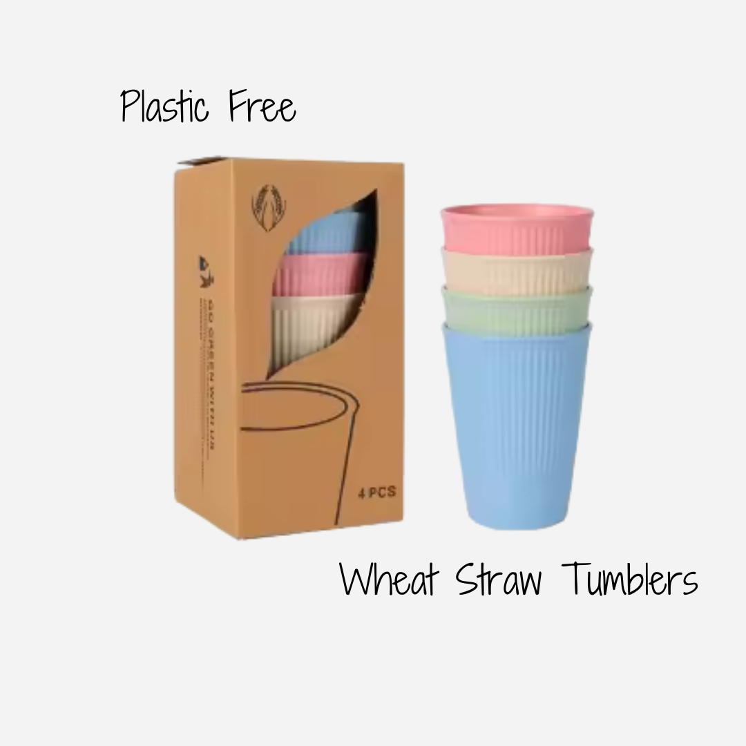 Set of four plastic-free, wheat-straw tumblers in pink, cream, light green and light blue in a cardboard box.