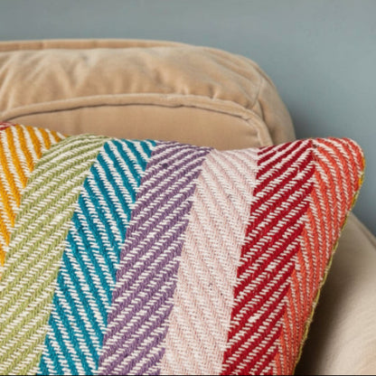 Colorful patterned cushions on a beige sofa