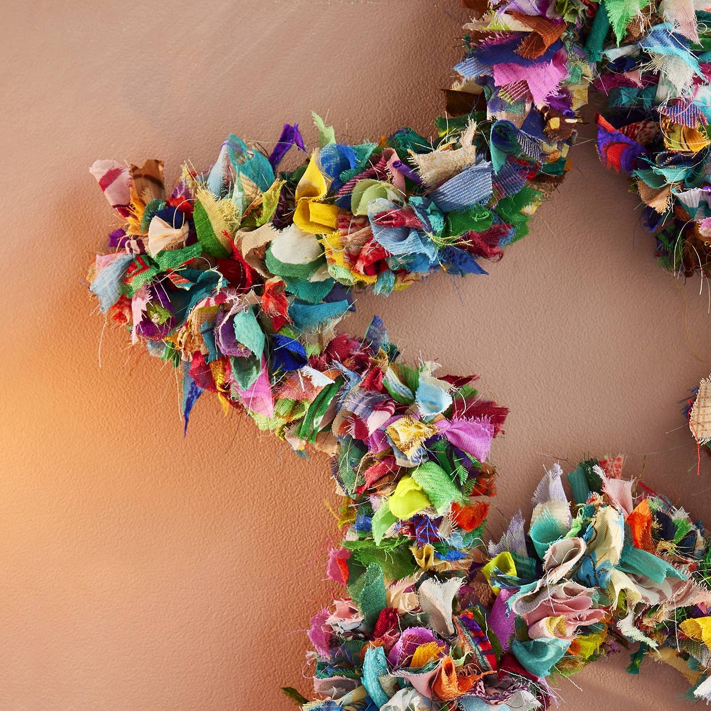 Colorful decorative recycled sari fabric star-shaped wreath 