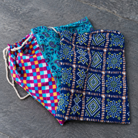 fan of three colourfulrecycled sari gift bags with hessian draw string 32cm x 40cm