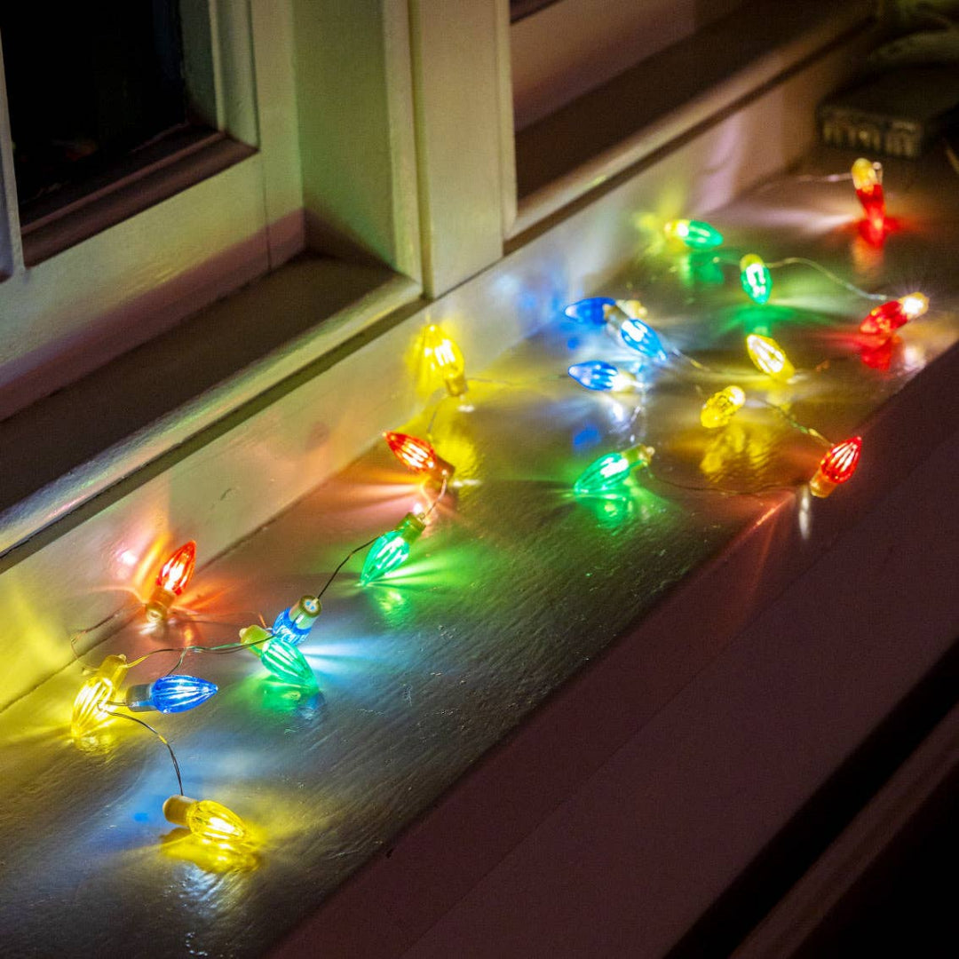 String of colorful lights on a window sill