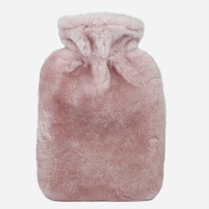 rose pink sheepskin hot water bottle on light grey background