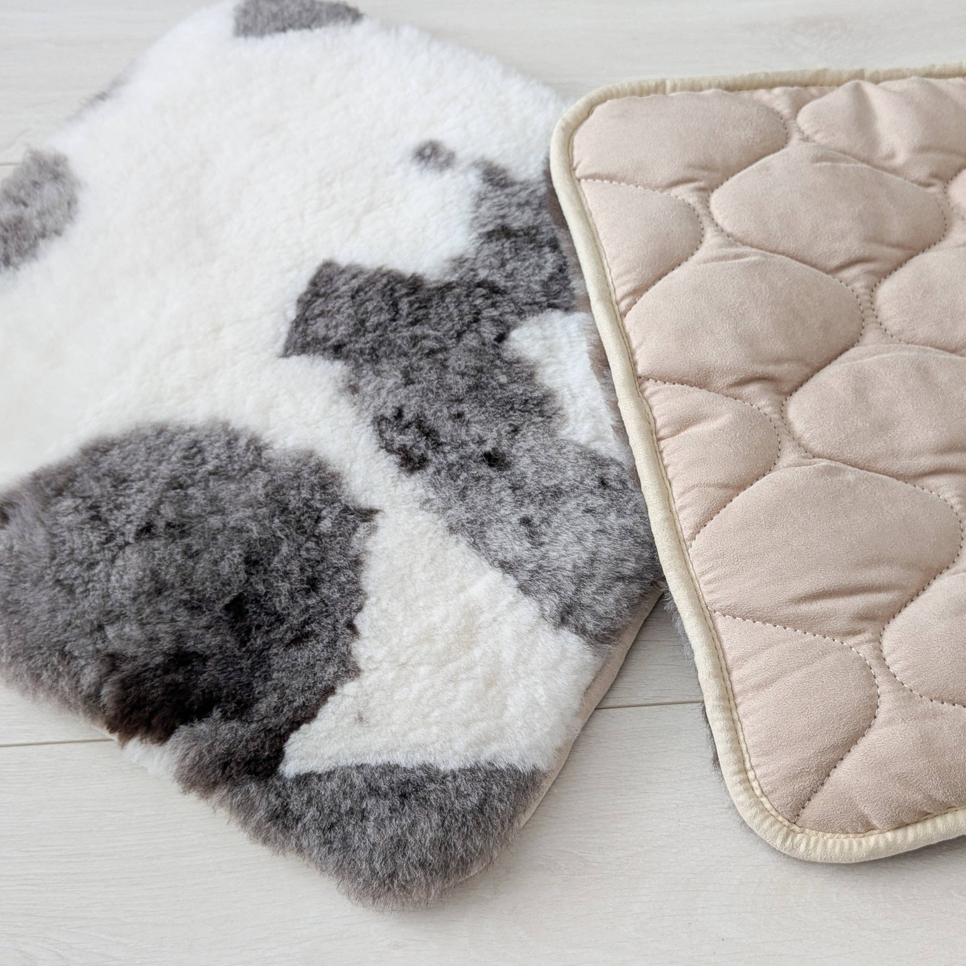 two natural sheepskin seat pads, one showing quilted underside