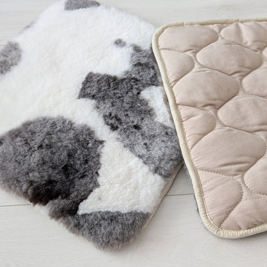 two natural sheepskin seat pads, one showing quilted underside