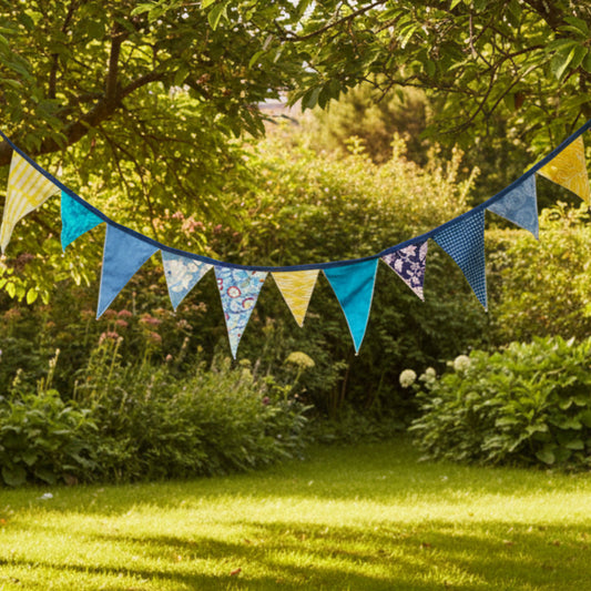 Colorful blue and yellow fabric bunting with various patterns on a white background