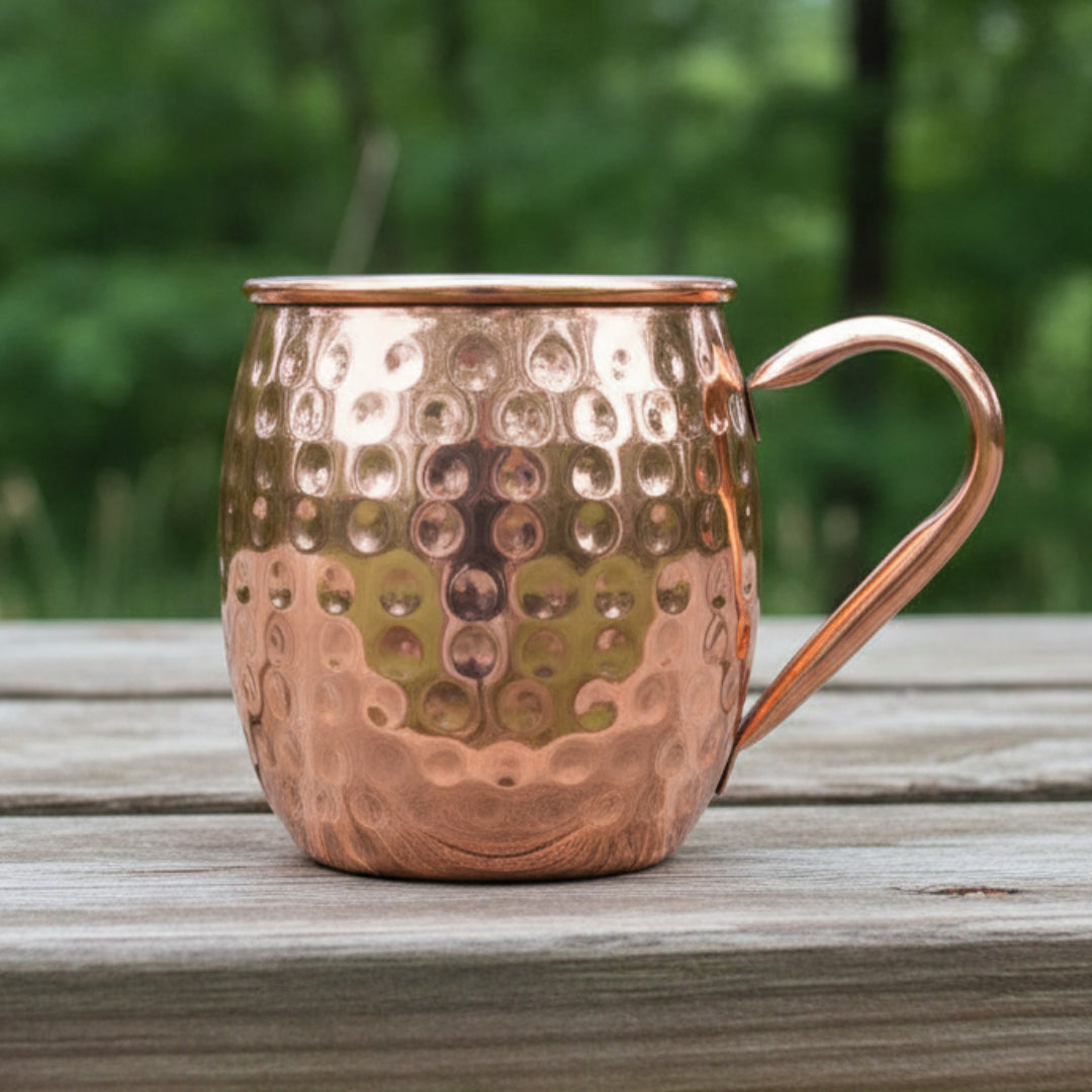 Copper mug with a textured surface on a natural background