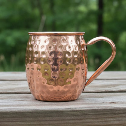 Copper mug with a textured surface on a natural background