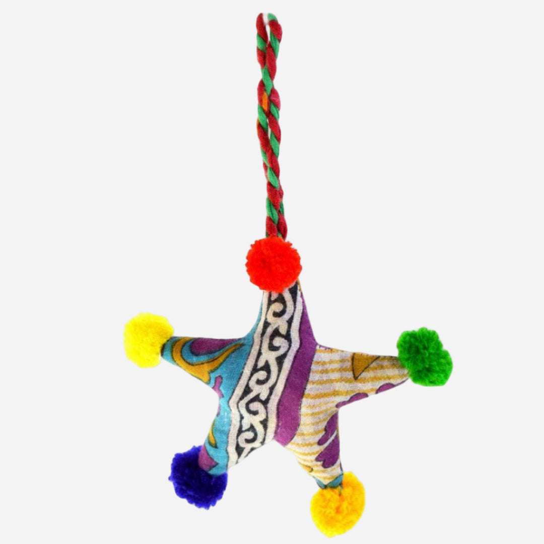 Colorful star shaped hanging decoration with pom-poms, and patterned design 