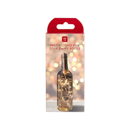 Packaging of bottle lights with a red top and clear body, featuring a blurred background.