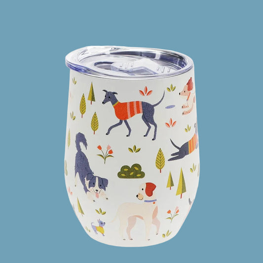 white travel mug with plastic lid and dog park print on blue background