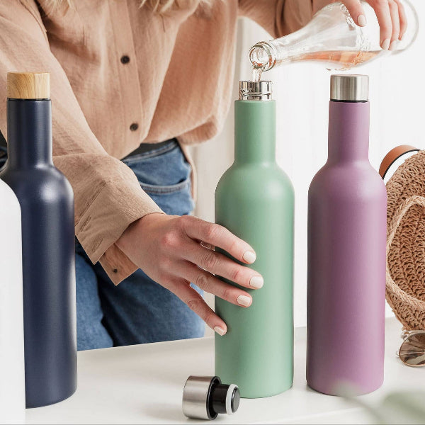 Female pouring rose wine into green insulated travel wine bottle (750ml)
