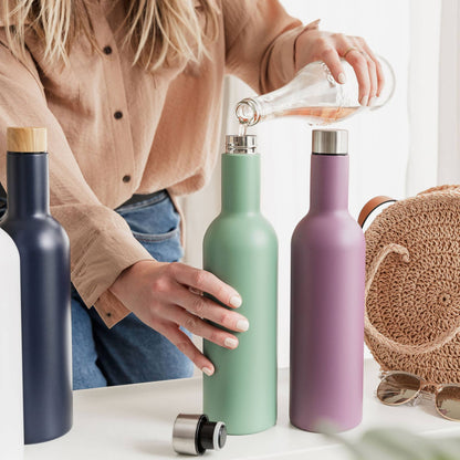 Female pouring rose wine into green insulated travel wine bottle (750ml)